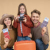 family with daughter holding passports luggage ready travel