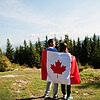 happy canada day couple with large canadian img