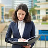serious businesswoman reading papers