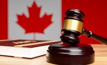 closeup judge s hammer wooden table against background canadian flag concept canadian legislation3d rendering
